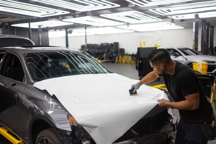 Car getting prepared for vinyl wrap.