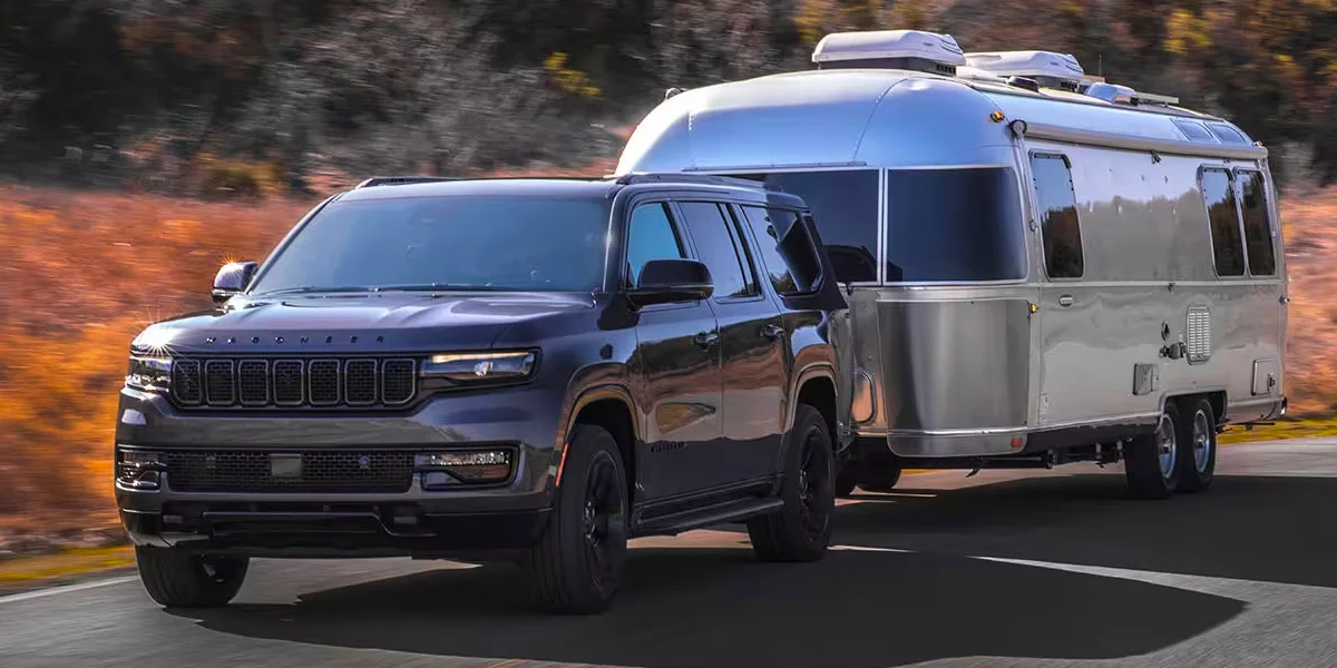 The 2024 Wagoneer hauling a trailer behind it