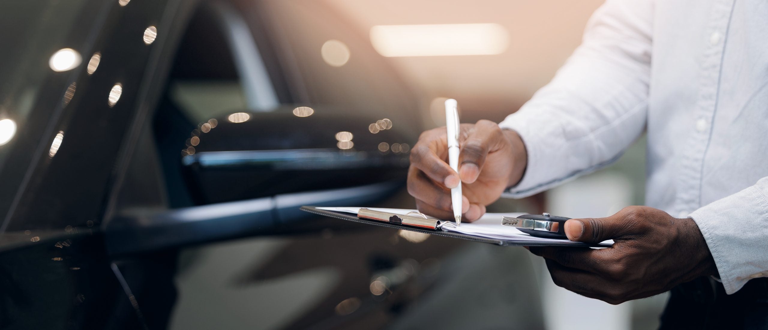 Concept banner business sell car for customer or service of rent automobile. Salesman selling cars in showroom use tablet for insurance