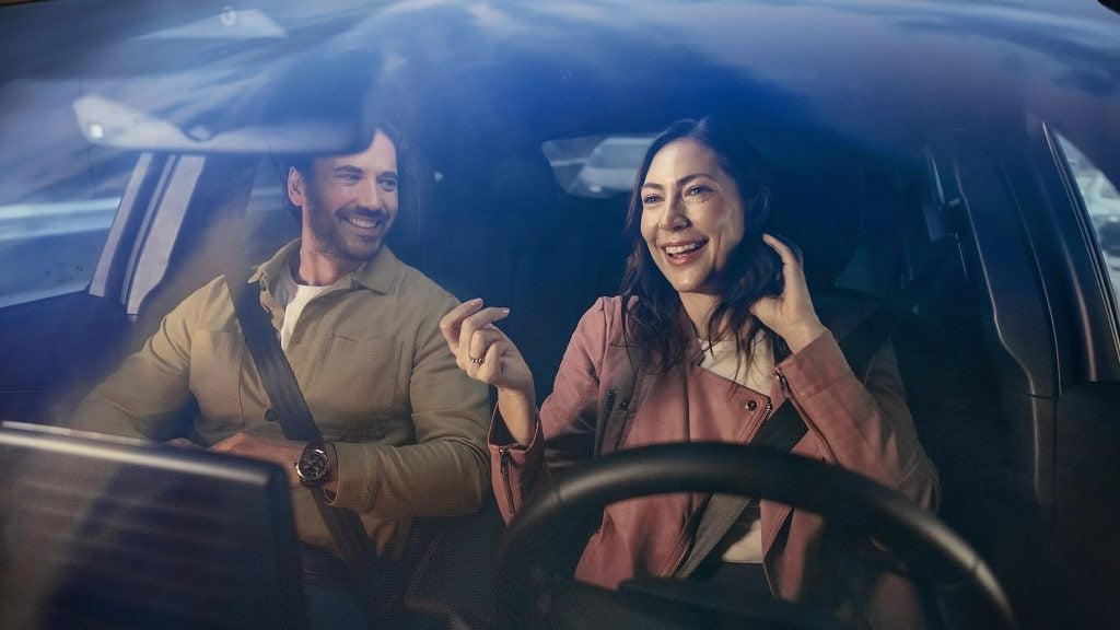 People sitting inside the Ford Mustang Mach-E enjoying spacious electric SUV interior