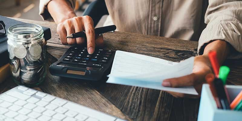 Calculator and paperwork used for Ford auto financing