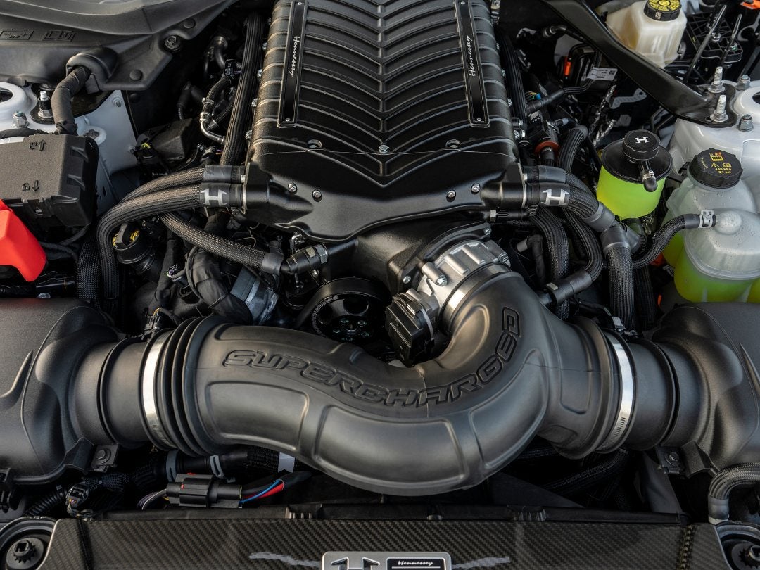 Hennessey supercharger installed on a Ford V8, covered by Hennessey's warranty rather than Ford's, at Power Ford near Albuquerque, NM