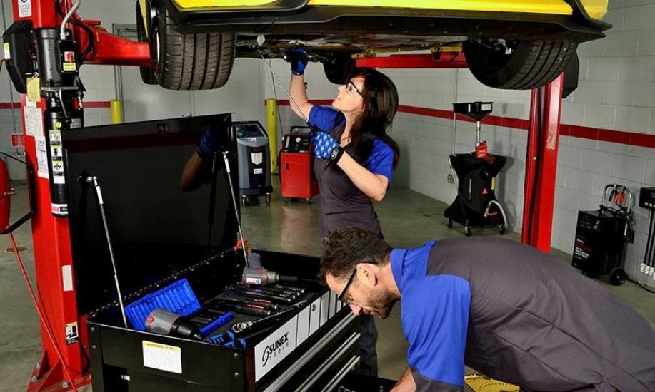 ford-technician-working-on-vehicle