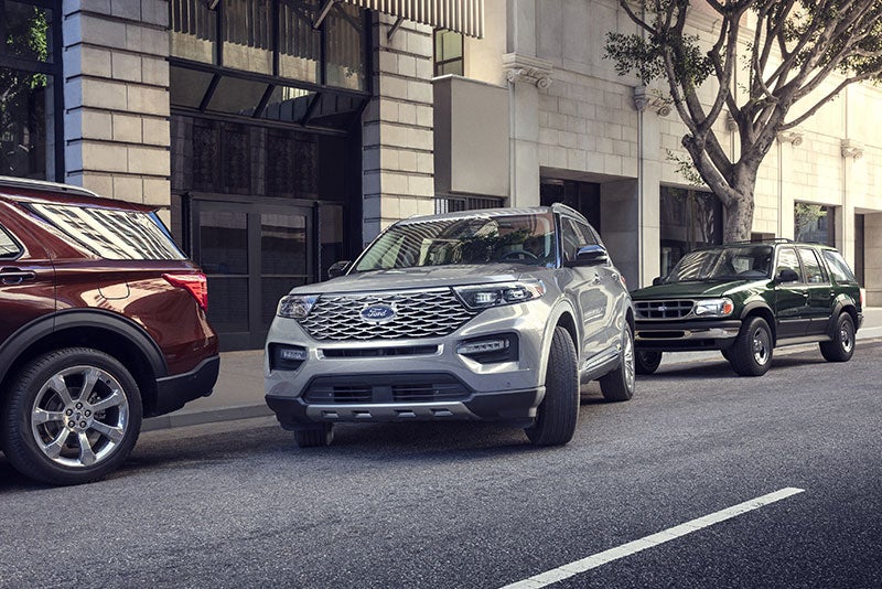 Ford SUV lineup parked city street