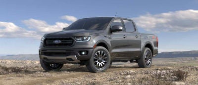 Magnetic color 2019 Ford Ranger exterior front fascia and drivers side parked in wilderness
