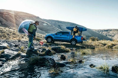 2019 Ford Ranger exterior passenger side profile with 2 men and kayaks