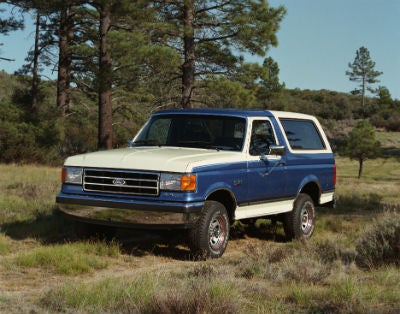 1989 Ford Bronco exterior front fascia and drivers side parked in grass