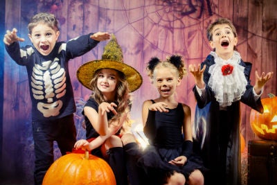 4 children dressed up for Halloween