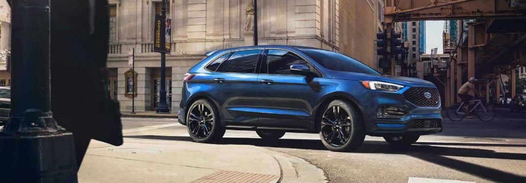 2019 Ford Edge exterior front fascia and passenger side on city road