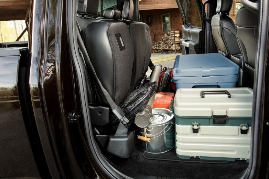 Side view of the 2018 Ford F-150's rear seat folded up and filled with cargo