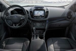 2018 Ford Escape interior front cabin steering wheel and dash with coastline in window