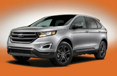 2018 Ford Edge exterior front fascia and drivers side on orange background