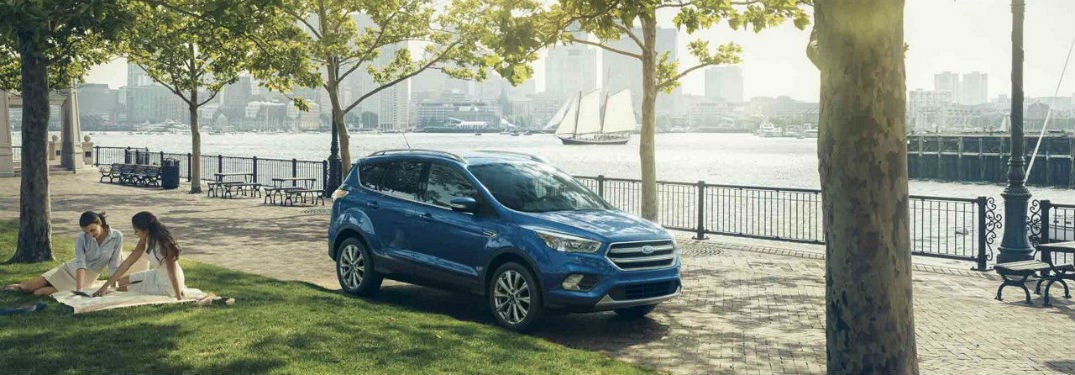 2018 Ford Escape exterior front fascia passenger side parked with girls on blanket in grass