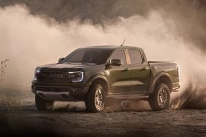 A 2025 Ford Ranger driving on a dirt road.