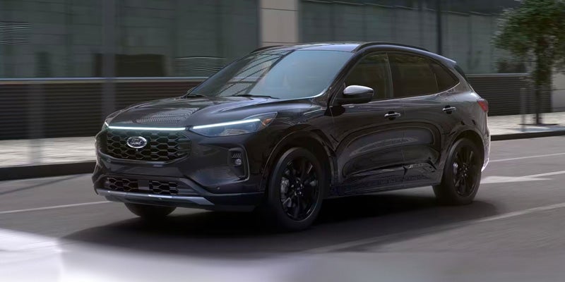 2024 Ford Escape Plug In Hybrid driving down city street