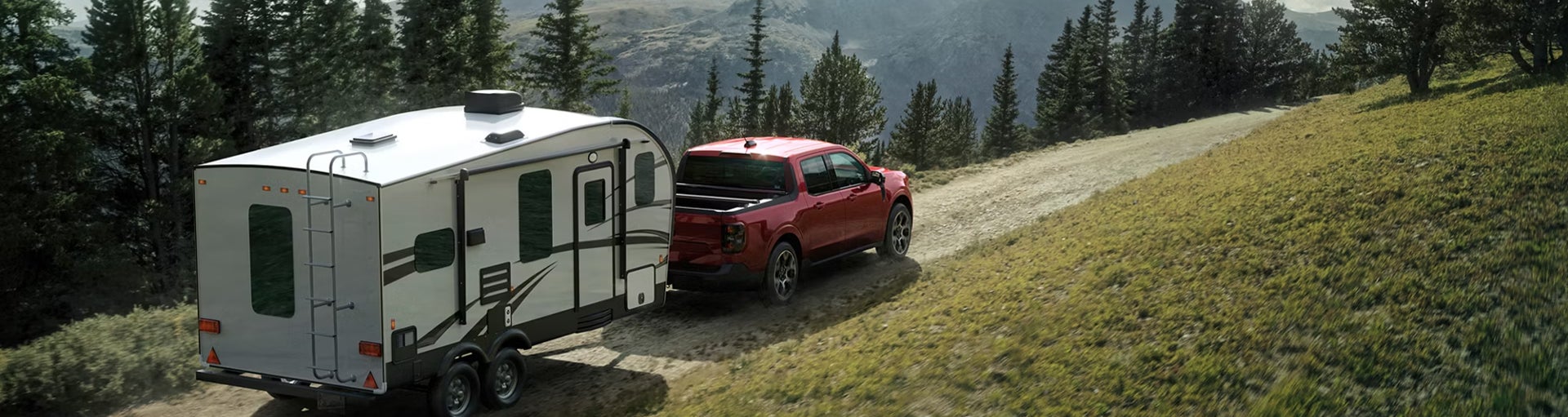 A Ford Maverick driving up a hill and pulling a trailer behind it.