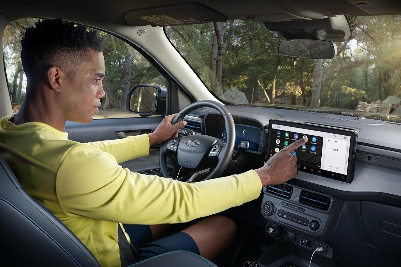 Person using the 13.2 inch center display in a Ford Maverick