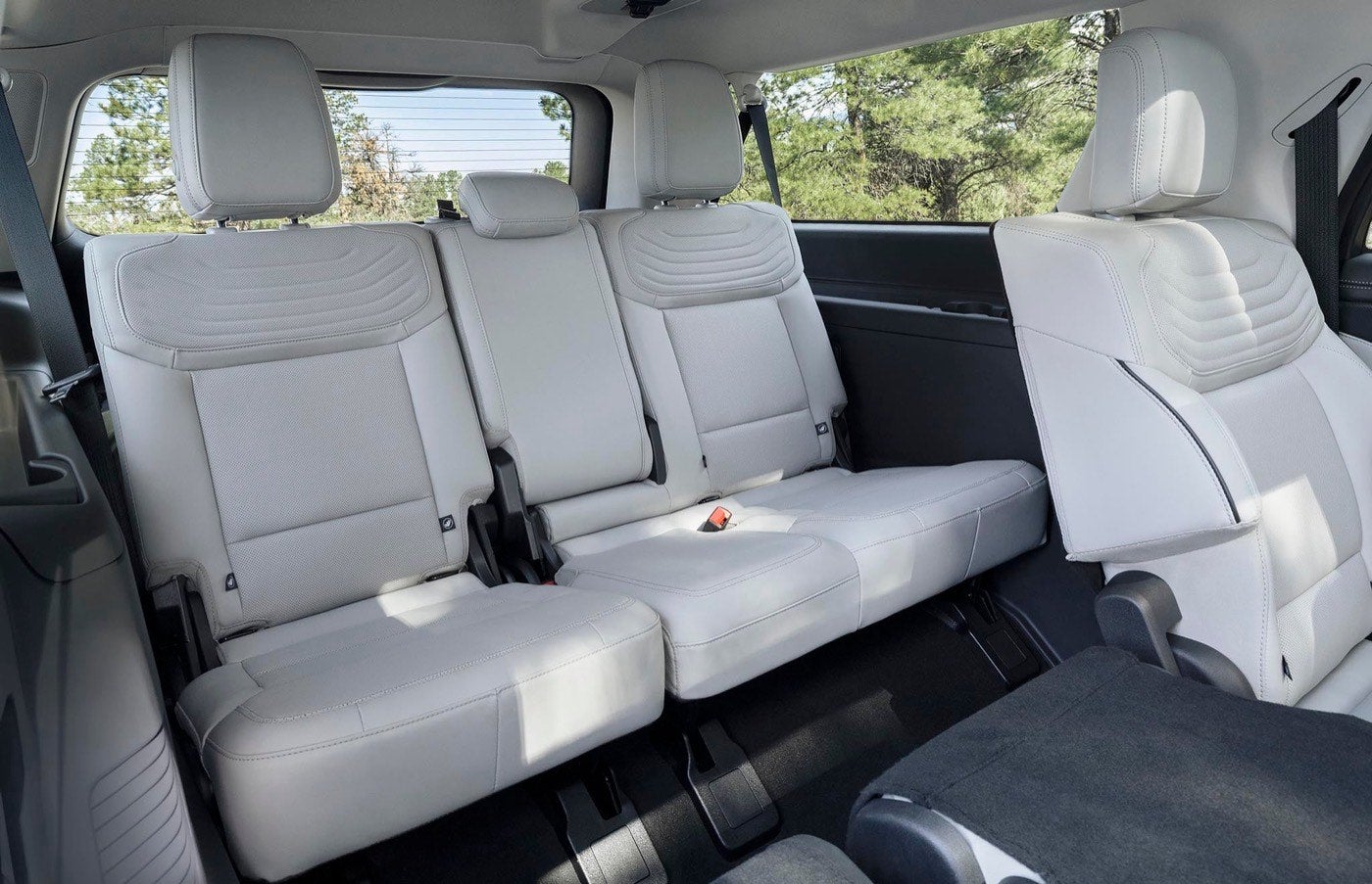 Rear seating area of a Ford Expedition Platinum with a seat folded flat
