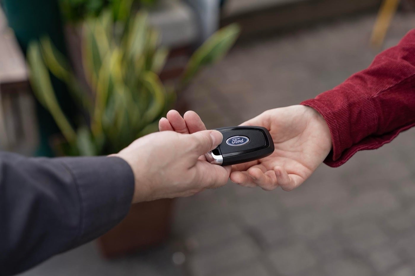 Ford Mobile Service technician handing keys back to an owner