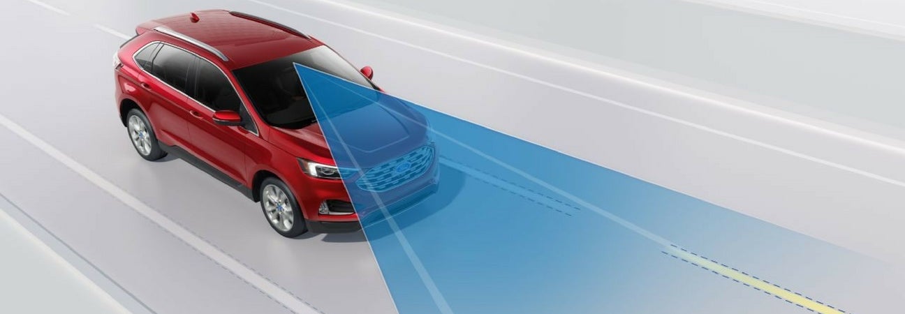 2019 Ford Edge projecting blue beam onto the road ahead
