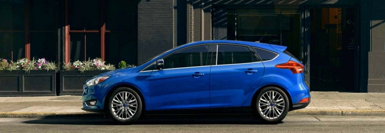 Blue 2018 Ford Focus parked curbside