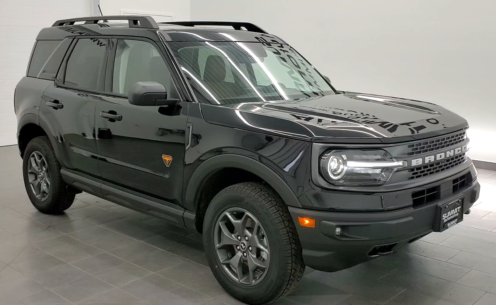 Front view of Ford Bronco Sport Badlands on showroom floor representing strong sales