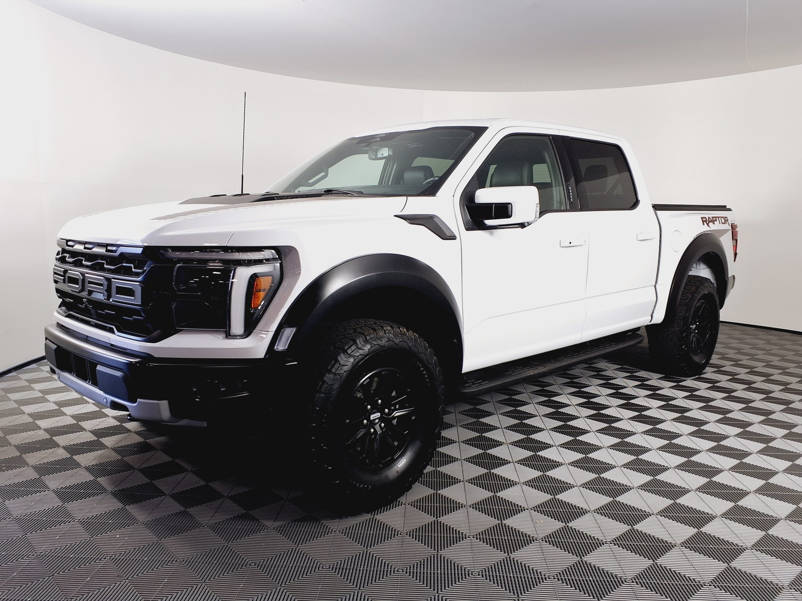 Ford F-150 Raptor with Method wheel kit in off-road setting