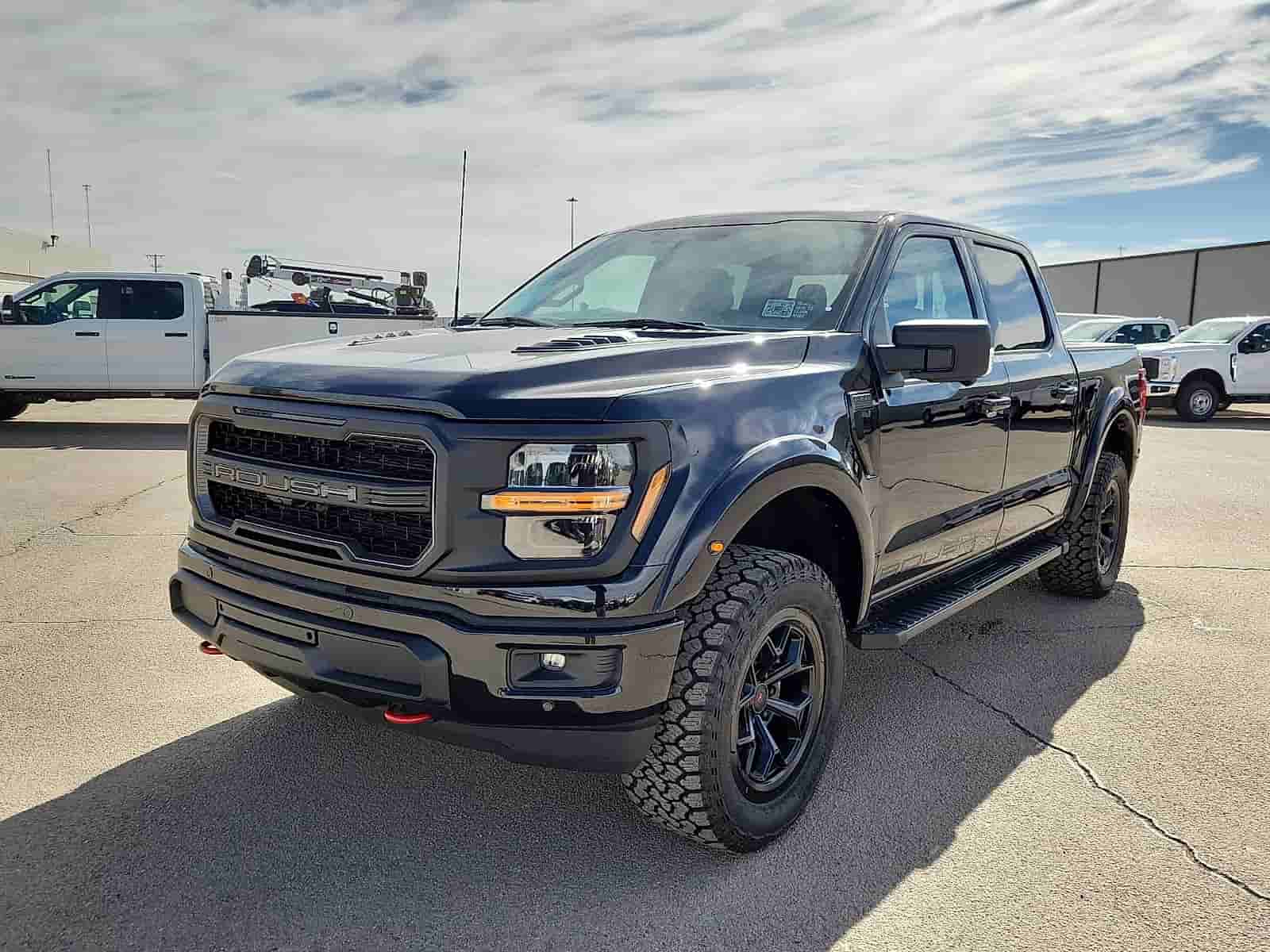 ROUSH and Rocky Ridge lifted Ford trucks at Rogers Ford in Midland, TX, built for West Texas driving