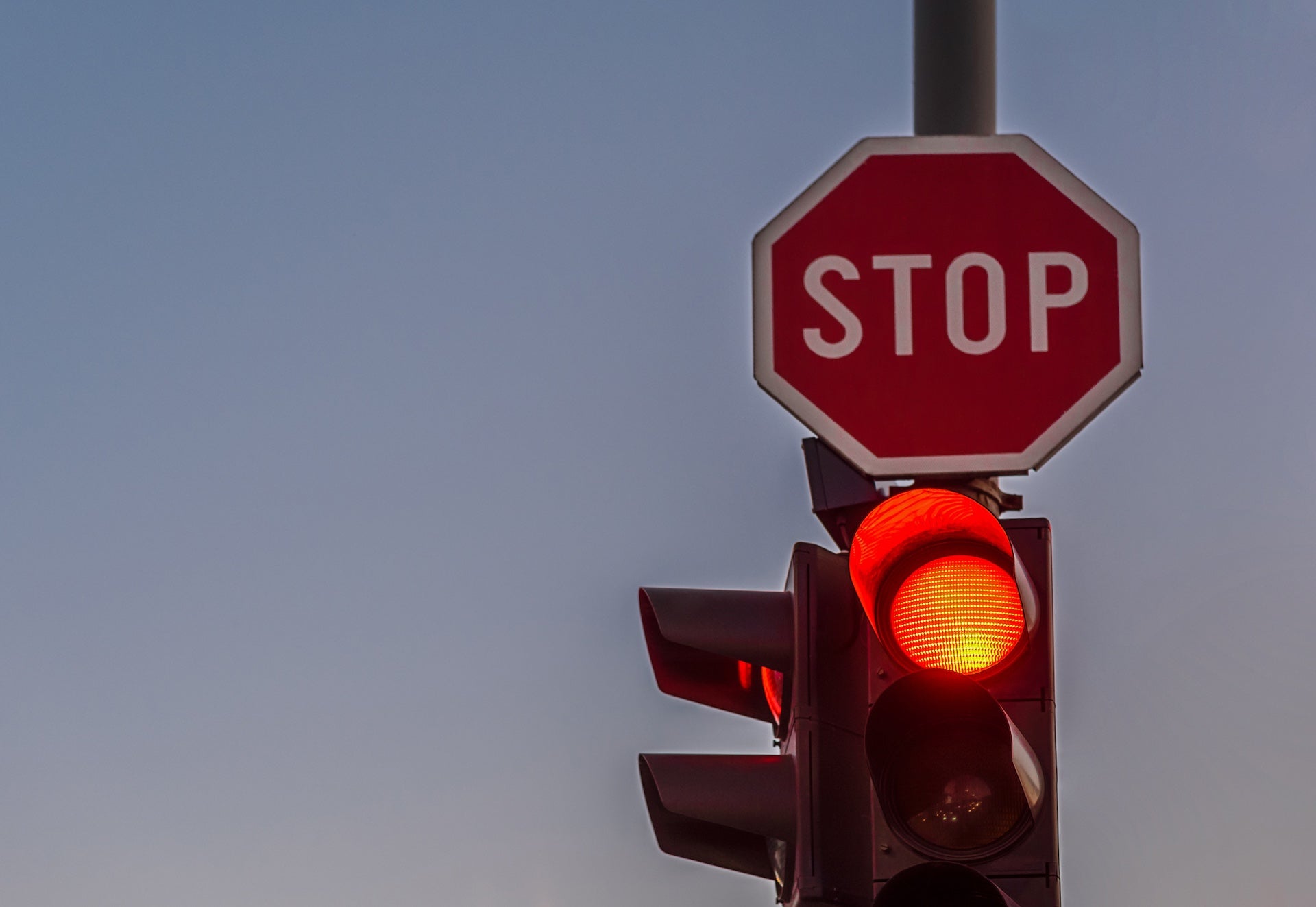 red traffic light and Stop sign