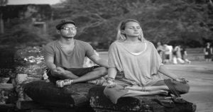 A woman and a man doing yoga in a park | San Antonio, TX