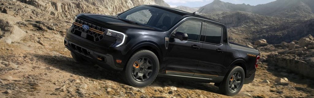 Ford Maverick Tremor driving off-road on a rocky desert trail