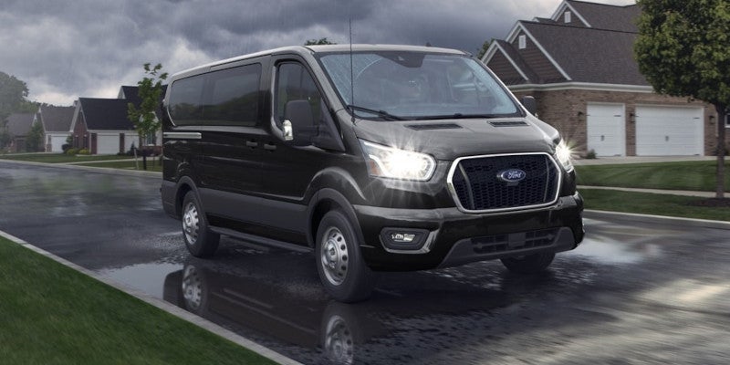 a 2025 Ford E-Transit parked in a neighborhood