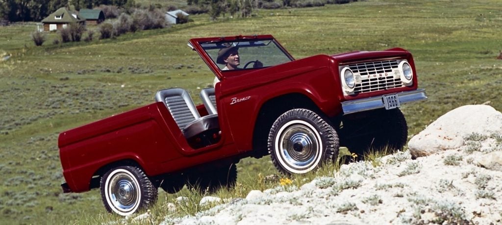 1966 Ford Bronco climbing a rocky hillside