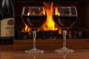 a couple of filled wine glasses on a romantic date rochester