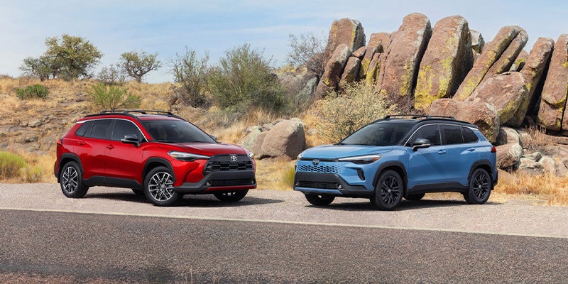 Toyota Corolla Cross in red and one in blue