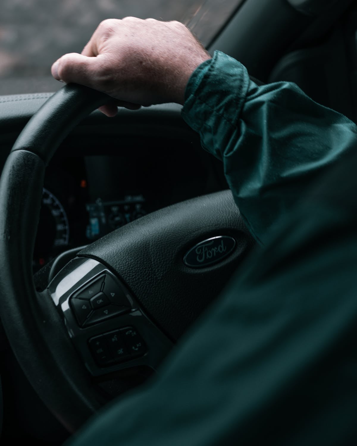A person driving their new Ford car