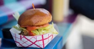 A cheeseburger being served from a food truck in Wichita, KS