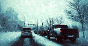Cars at a Wichita, KS red light in the snow