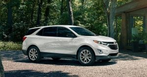 A white 2020 Chevy Equinox parked outside of a cabin near Wichita, KS