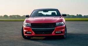 A red 2019 Dodge Charger on a blacktop track in Wichita, KS