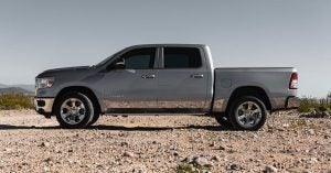 The all-new RAM 1500 in grey parked on a dirt road in Wichita, KS.