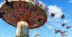 People riding on a swing ride at a local festival in Wichita, KS