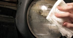 Wiping grime off of a headlight in Wichita, KS