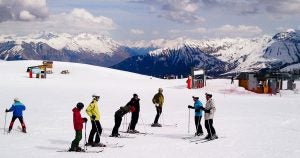 Family skiing on a mountain