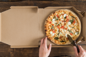 Person Slicing Pizza 