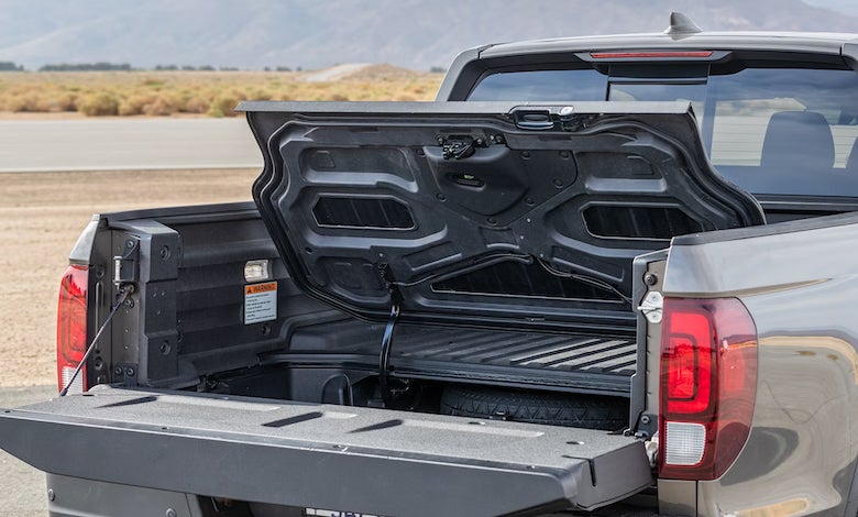 The 2026 Honda Ridgeline is a midsize unibody pickup truck offering 280-horsepower V6 engine and a lockable in-bed trunk.