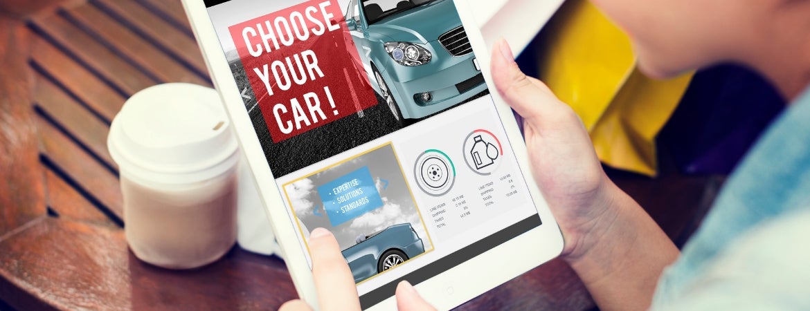 Person reading tablet that says "Choose Your Car!"
