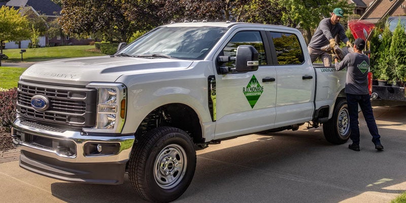 2026 Ford F-350 parked two men are unloading the luggage