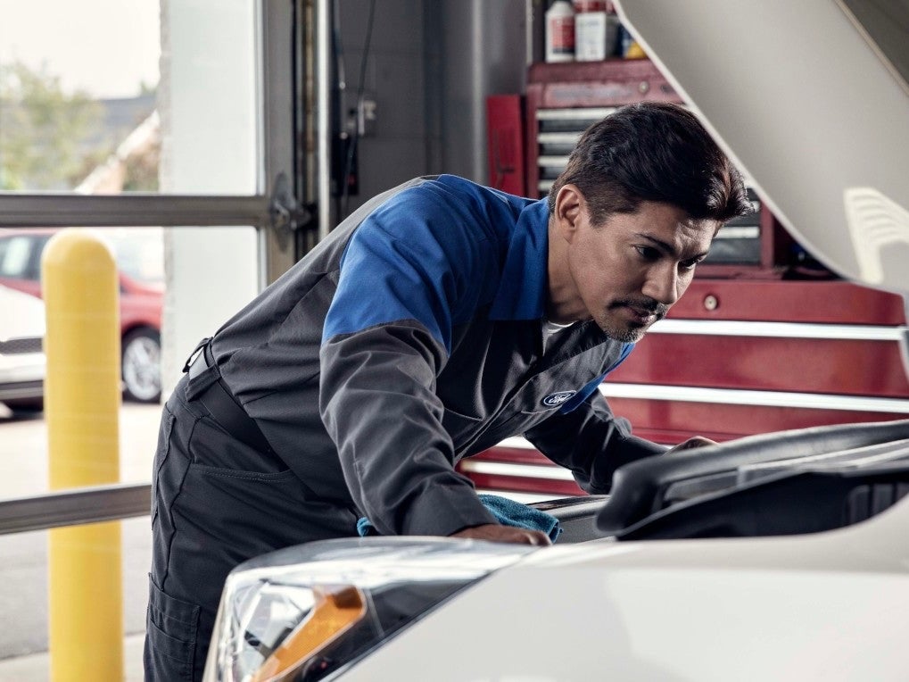 Ford technician performing routine maintenance