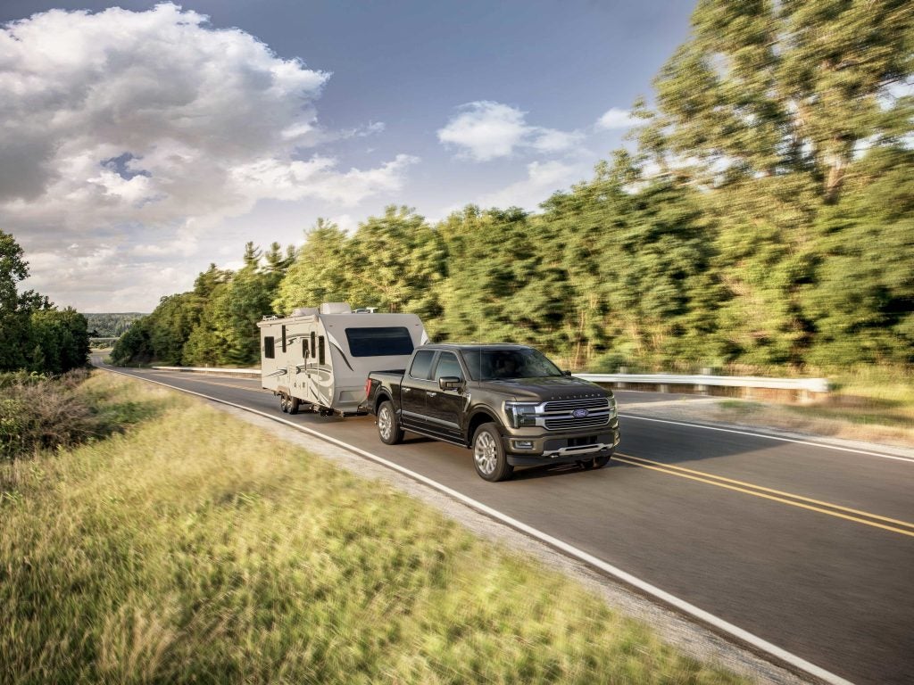 2024 Ford F-150 Platinum in black towing RV